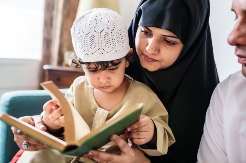 Parents Showing Quran the Importance of Quran to Child